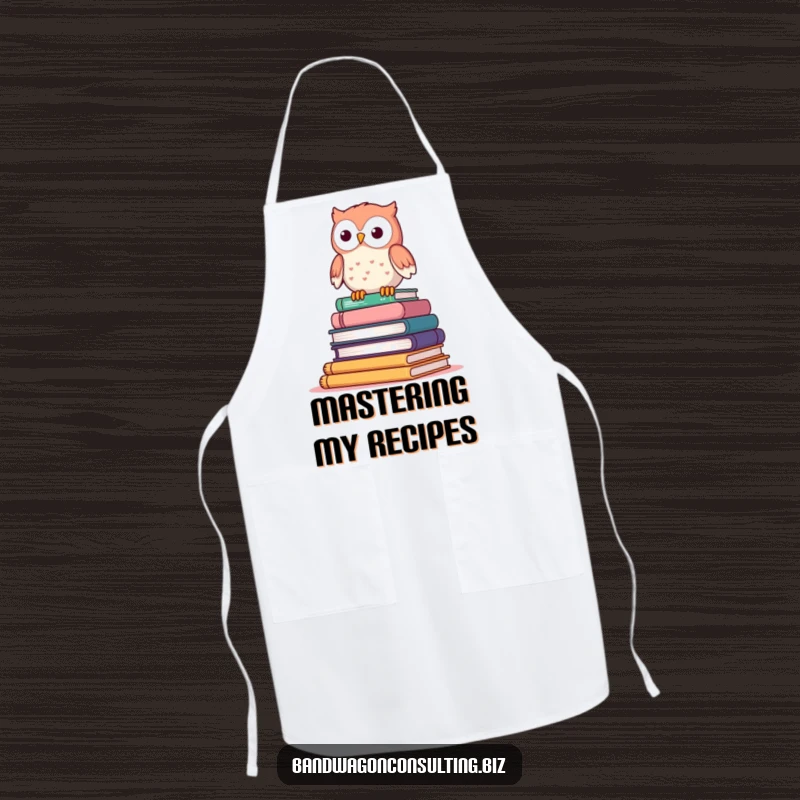 Funny apron featuring a cute owl character perched atop a wobbly stack of books, ready for kitchen duty.