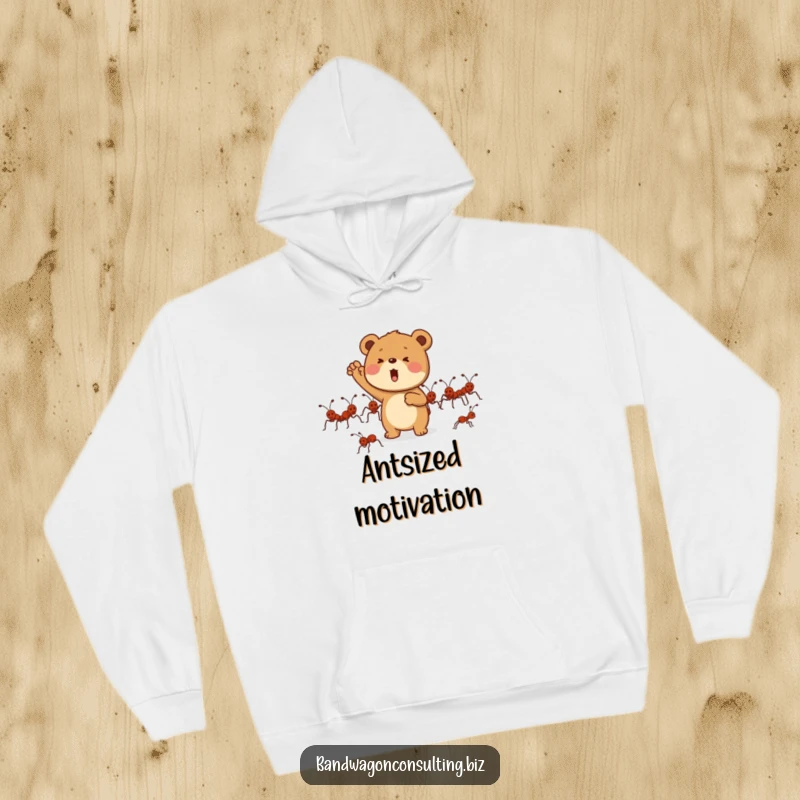 Funny hoodie featuring a determined bear cub mascot enthusiastically cheering for a marching line of ants.